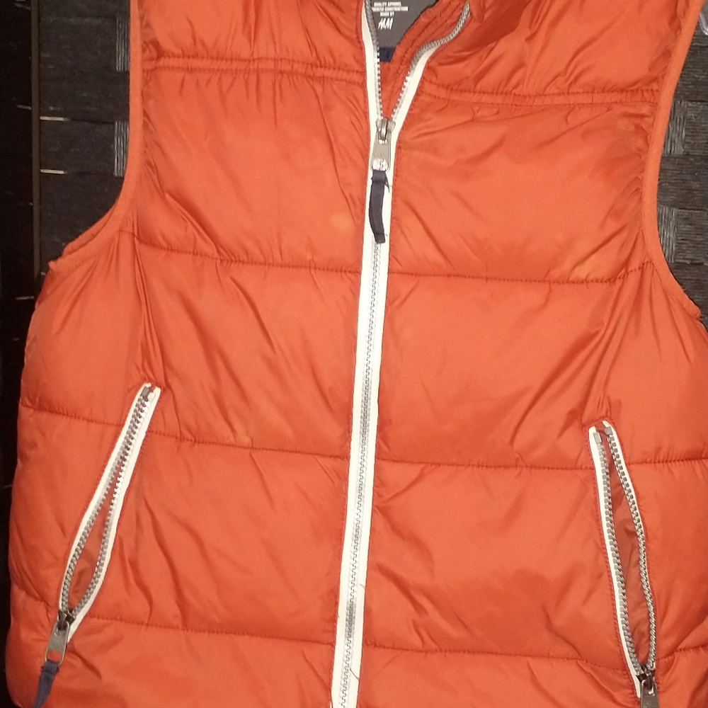 Polyester insulated hooded Orange vest jacket. Like new condition. Zip pockets.